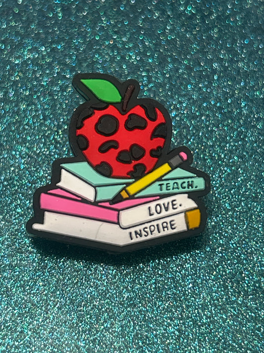 Teach Love Inspire Cow print on books