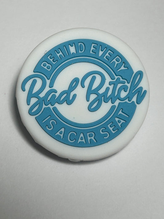 Behind Ever Bad B!tch is a car seat